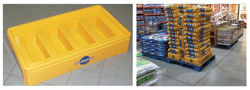 A tray of Pedigree dog food with packaging and bowls.