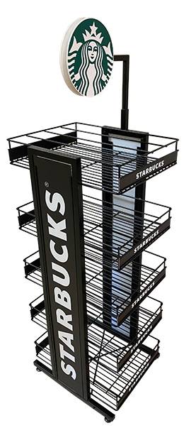 A Starbucks coffee cup with a logo, placed on a iron rack.